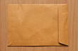 Close Brown Envelope document on wood background