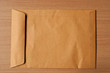 Close Brown Envelope document on wood background
