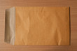 Open Brown Envelope document on wood background
