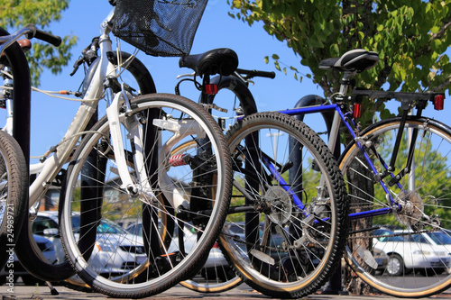 Photo: Bikes and cars at a park and ride Bikes and cars at a park and ride