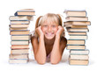 Back to School Concept.School Girl between the stacks of books. Back to School Concept.School Girl between the stacks of books.