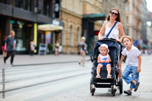 Photo: Family walking in city center Family walking in city center