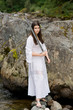 Young girl in white dress with two handed sword Young girl in white dress with two handed sword