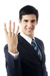 Happy businessman showing four fingers, isolated on white Happy businessman showing four fingers, isolated on white