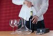 Waitress opening wine