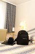 Photo: hotel room with backpack and laptop on bed hotel room with backpack and laptop on bed