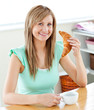 Animated young woman eating a croissant holding a cup in the kit