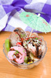 Glass cup with sweet icecream on wooden table top