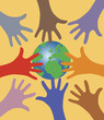 Many hands reaching out for the world globe