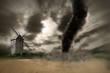 Photo: Large tornado over a wind mill Large tornado over a wind mill