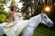 Horse riding wedding woman at sunset
