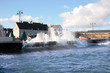 waves crashing against shore wall