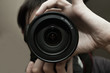 Men's hands held camera