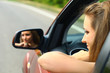 young woman in a red car