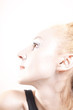 young blond woman with shiny silver makeup