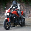 man dismounting motorbike man dismounting motorbike