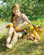 girl sitting near harvested vegetables girl sitting near harvested vegetables