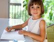 Elementary school pupil writing