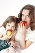 Mom and daughter with apples