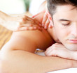 Foto: Close-up of an attractive man having a back massage Close-up of an attractive man having a back massage