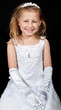 smiling young girl in white dress on black