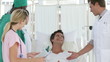 hospital team joking with a patient