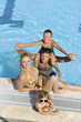 happy young family have fun on swimming pool