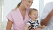 nurse and doctor looking after a baby