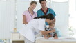 Thoughtful Hospital personnel with a baby