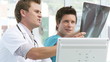 two doctors talking about an x-ray