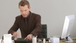 Businessman working on his desk with a phone
