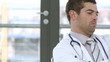 Serious doctor looking at an X-ray