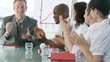 Businessteam with team-spirit clapping in a presentation