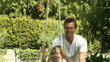 Careful Father pushes his son on a swing