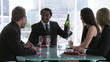 fresh young businessteam celebrating success with champagne
