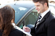 Confident businessman undersign a car contract Confident businessman undersign a car contract