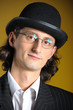 Photo: Close up retro portrait of young english gentleman in bowler hat Close up retro portrait of young english gentleman in bowler hat