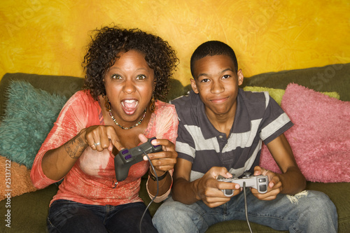 Photo: African-American family playing video game African-American family playing video game