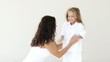 Mother tickles her daughter