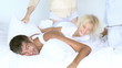 happy family having pillow fight