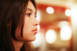 Closeup portrait of beautiful Asian woman indoors. Shallow DOF.