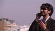 man on a bridge with cellphone