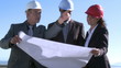Three architects talking and exchanging their opinions
