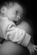 Newborn on mothers shoulder
