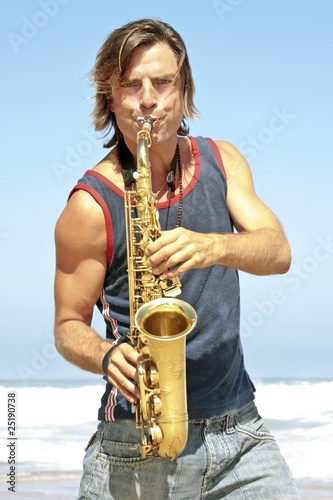 Professional saxophone player at the beach
