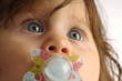 Little girl with teat