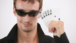 Cool guy is throwing the cards into the camera