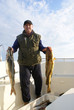 Foto: Fisherman with big fish on the boat Fisherman with big fish on the boat