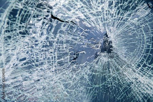 Photo: Broken car windshield. Tint blue Broken car windshield. Tint blue
