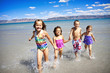 Children having Playing at the Beach Children having Playing at the Beach
